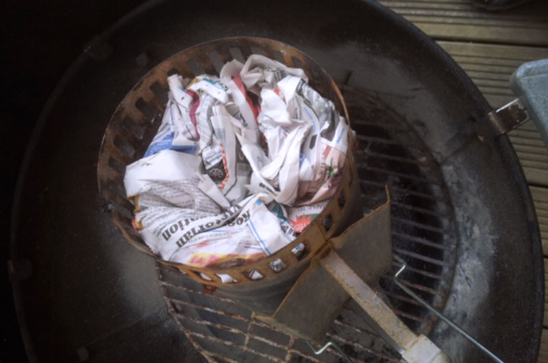 Newspapers at the bottom of the chimney starter