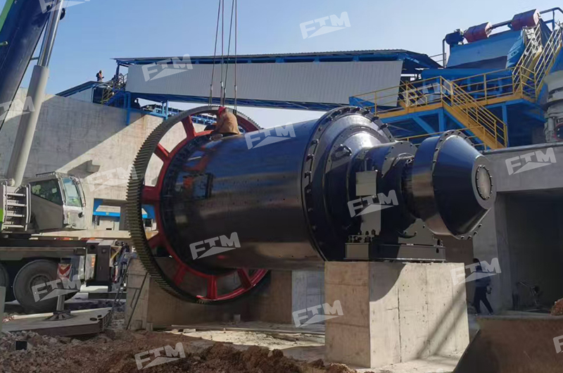 Grinding cement with a ball mill