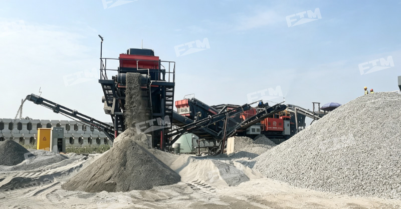 Large mobile crusher processing rock at a quarry site